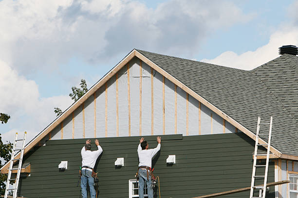 Professional Siding Installation technician working in Cape Charles, VA